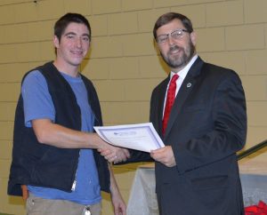 Skyler Cole of Calais receives a scholarship from Dr. Hoops, D.D.S. from the 2016 WCCC Golf Tournament.