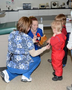 Medical Assisting students Jordyn Turner(solid blue) and Breanna Black (multi color) take care of two very important patients at the WCCC Teddy Bear clinic.