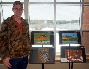 Greg Holst stands with his beautiful artwork at the 2016 Senior Art Exhibit